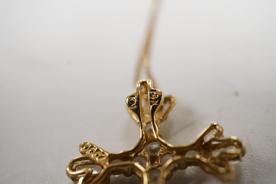 A recent 14k yellow metal and cubic zirconia cluster set cross pendant, 22mm, on a 585 yellow metal fine link chain(knotted).